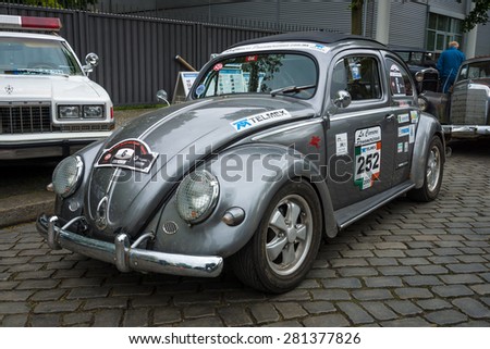 BERLIN - MAY 10, 2015: Subcompact, economy car Volkswagen Beetle in sports coloring. 28th Berlin-Brandenburg Oldtimer Day