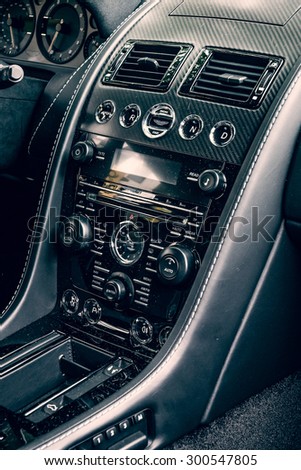BERLIN - JUNE 14, 2015: Fragment of the dashboard of a luxury sports car Aston Martin V8 Vantage N430 (since 2015). Toning. Stylization. The Classic Days on Kurfuerstendamm.