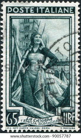 ITALY - CIRCA 1950: A stamp printed in Italy, shows Girl worker in hemp field, in the background Pomposa Abbey (Emilia-Romagna), circa 1950