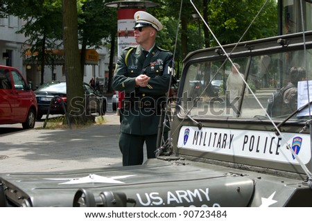 BERLIN - MAY 28: A man in the form of a military police car and Willys MB, the exhibition \