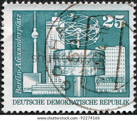 DDR - CIRCA 1973: A stamp printed in DDR, shows World clock, Alexander Square (Berlin), circa 1973