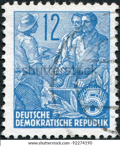 DDR - CIRCA 1953: A stamp printed in DDR, shown Worker, peasant and intellectual, circa 1953