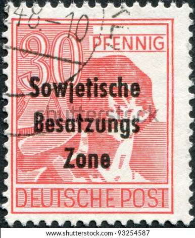 GERMANY - CIRCA 1948: A stamp printed in Germany, is shown worker with a hammer (overprint, the Soviet occupation zone), circa 1948