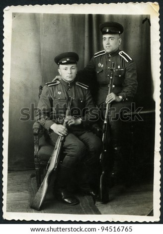 USSR - CIRCA 1950: Photo taken in the USSR, depicted two soldiers of the Red Army with weapons in hand, circa 1950