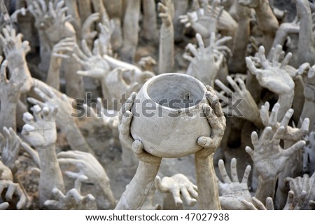hands reaching out, sculpture at Wat Rong Khun, the white temple near Chiang Rai, Thailand