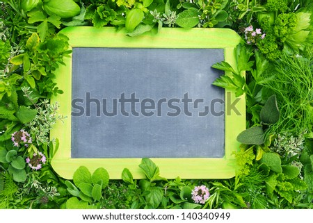 mix of fresh herbs with blackboard to insert texts