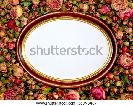 Oval picture frame in dried roses