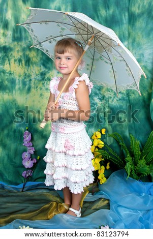 pretty girl with an openwork knitted dress umbrella