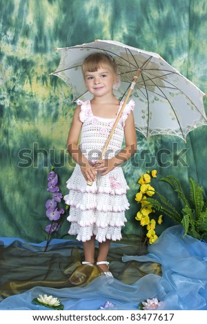 pretty girl with an openwork knitted dress umbrella