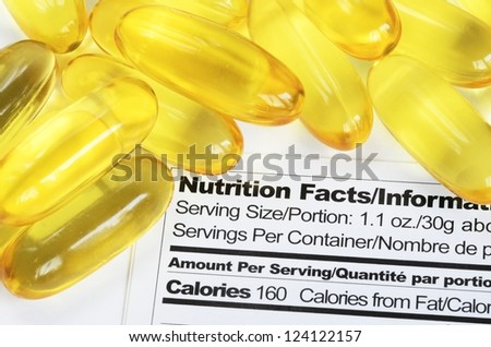 Nutrition label with fish oil pills concept healthy eating