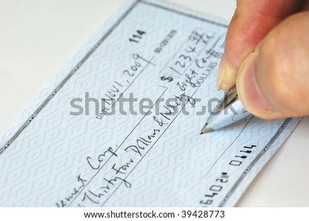 Writing a check to pay for  the bill