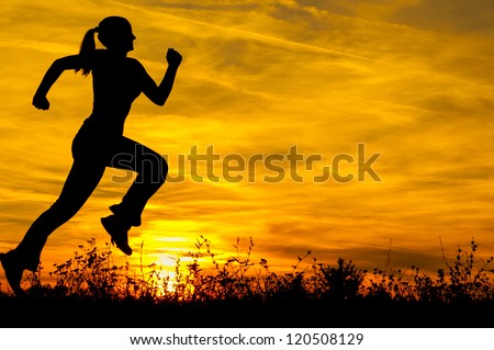 Silhouette of the running girl at sunrise Silhouette of the running girl at sunrise