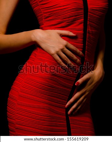 Lady in red skirt, isolated on black.