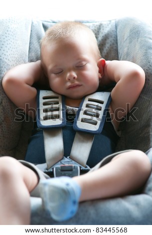 Baby Seat Belts on Infant Boy Sleeps Peacefully Secured With Seat Belts While In The Car