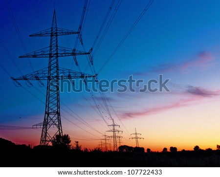 power plant by night - energy lines