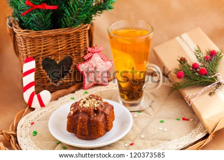Christmas composition with cake, tea, pine and present