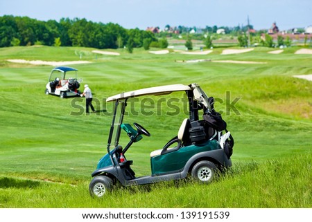 Golf club cars at golf field
