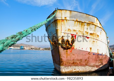 Old abandoned ship in harbor