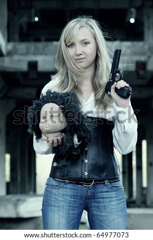 Bounty hunter woman with head and pistol in her hands