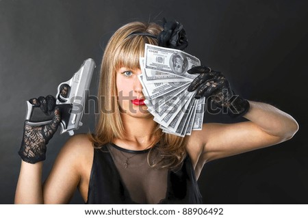 Woman with pistol and money