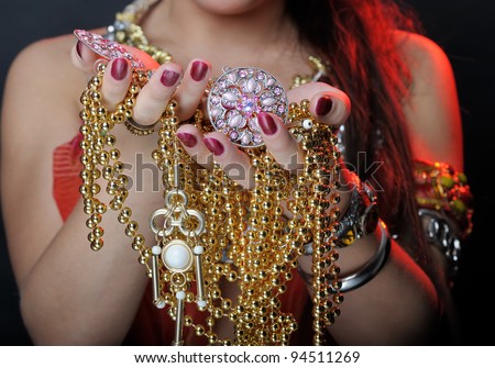 Jewel in hands of woman
