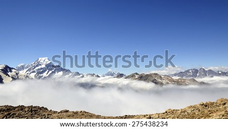 Mount Cook panoramic landscape above clouds blanket in Southern Alps, NZ.
