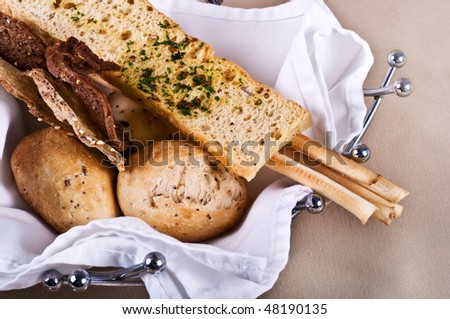roasted bread and Bread sticks in a steel basket