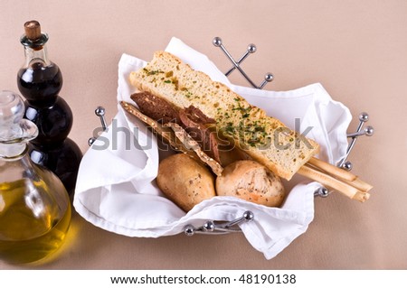 roasted bread and Bread sticks in a steel basket
