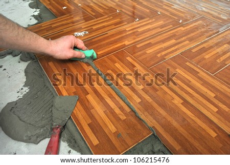 Laying tiles on the floor