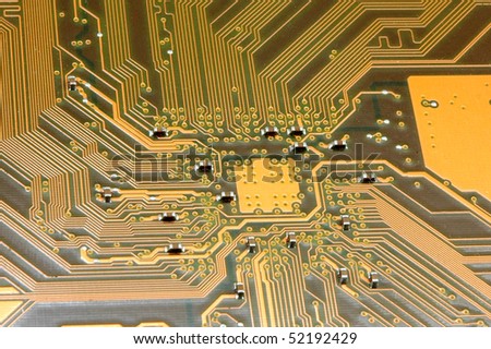 A close up of a yellow computer circuit.