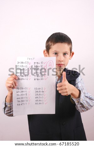 Young boy gets A grade on math test