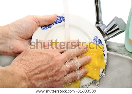 hand wash dishes under running water