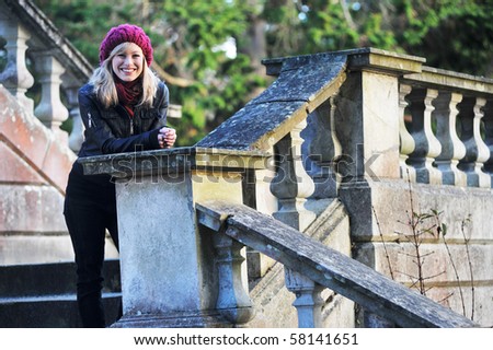 Outdoor Portrait Of Young Woman On Steps