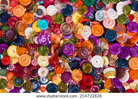 Various sewing button on white background.