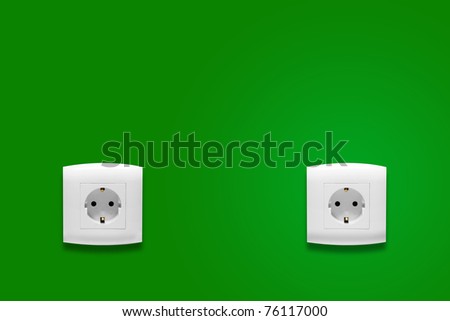Electric outlet on green wall