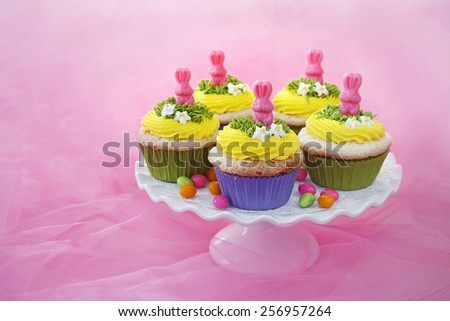 Easter cupcakes. Angel food cake with vanilla frosting and a candy bunny.
