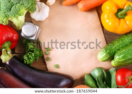 Vegetables on wood background with space for recipe. Organic food.