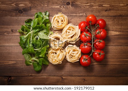 Italian flag of greens, pasta and tomatoes