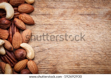 Nuts Set background with copyspace on a wood background
