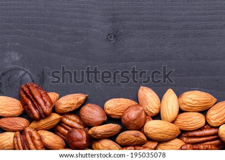 Nuts Set background with copyspace on a wood background