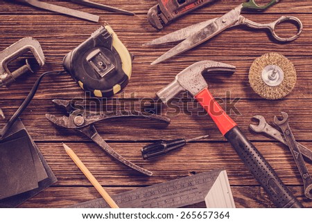 Vintage Carpentry, construction hardware tools on wooden background