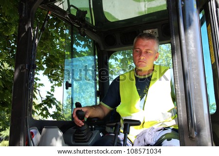 Heavy equipment operator. The operator of a excavator on a working site.