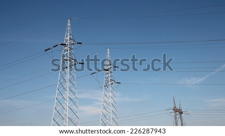 Electrical Transmission Towers. Electricity distribution. A line of electrical transmission towers carrying high voltage.