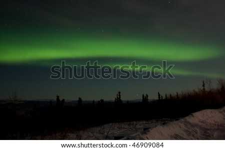 The northern lights produced shades of green that brightened up and covered the entire northern sky. Picture was taken north of Fairbanks, AK during the early morning hours on January 4, 2010.