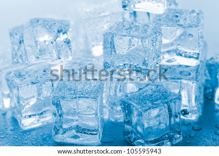 melting ice cubes on glass table