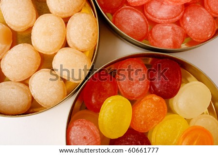 fruit drops in box isolated on white