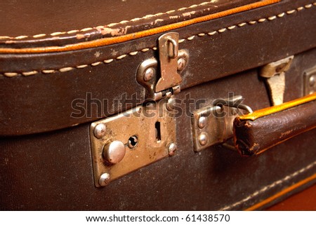vintage brown suitcase with open lock