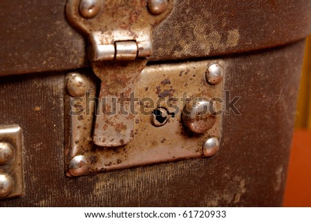 vintage brown suitcase with open lock