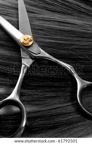 lock of hair and scissors. selective focus