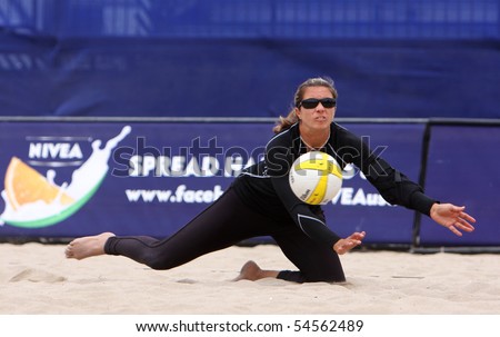 HUNTINGTON BEACH, CA - JUNE 4: Misty May-Treanor, Olympic gold medalist, is digging a ball at the AVP Huntington Open pro beach volleyball tournament June 4, 2010 in Huntington Beach, CA